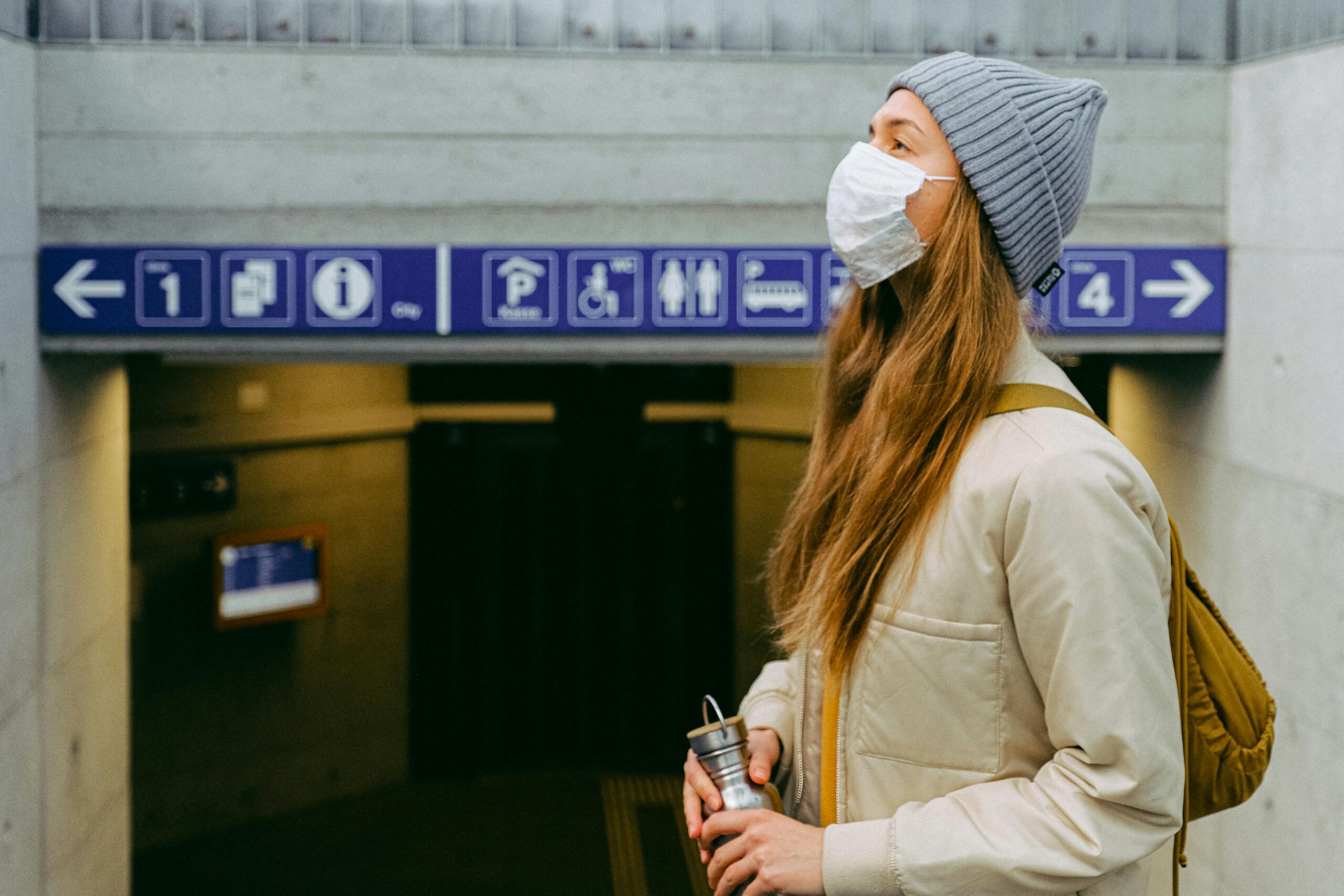 woman in mask on public transit