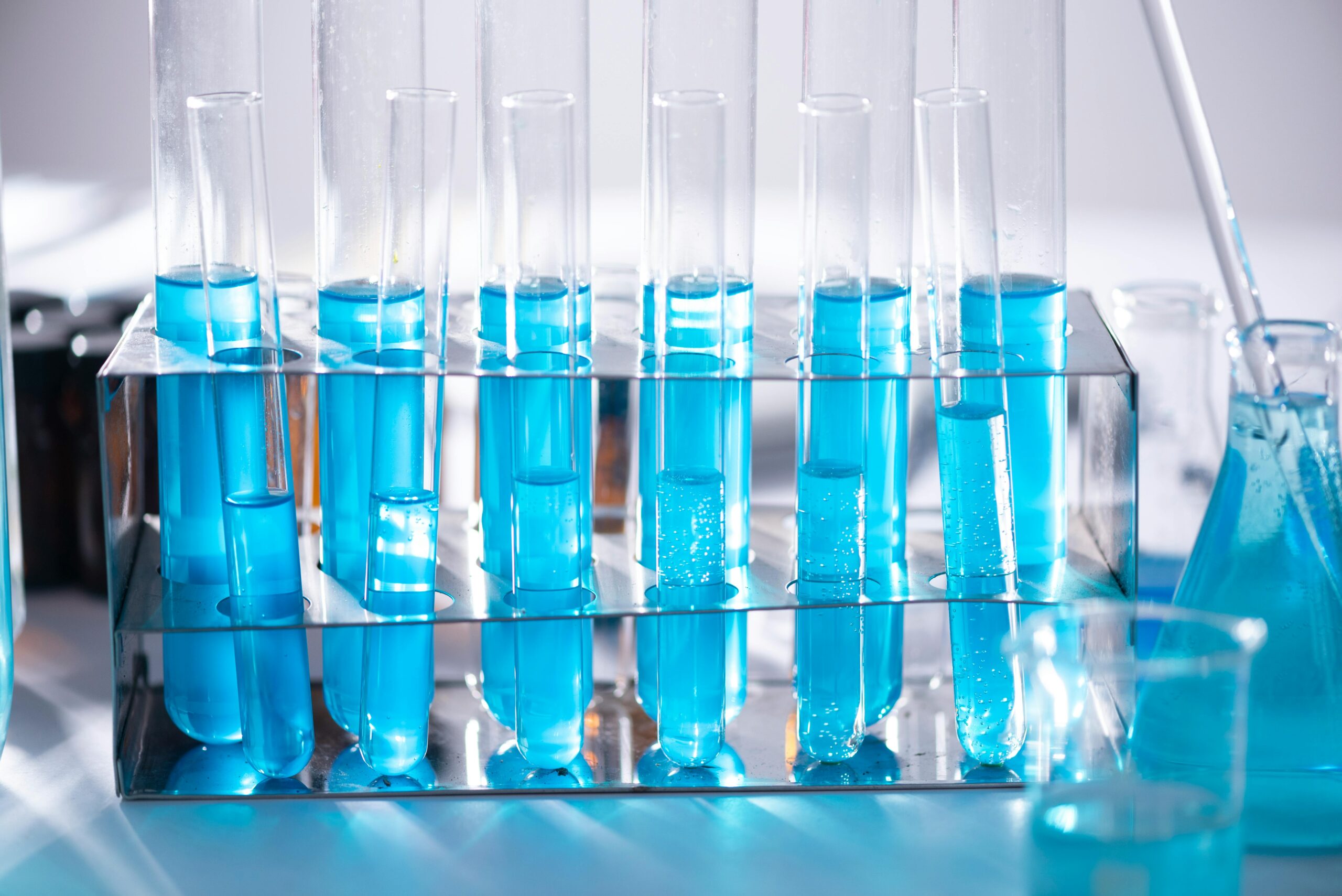 test tubes with blue liquid in a stand