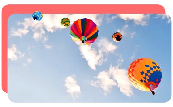 Stylized image of hot air balloons floating into the sky