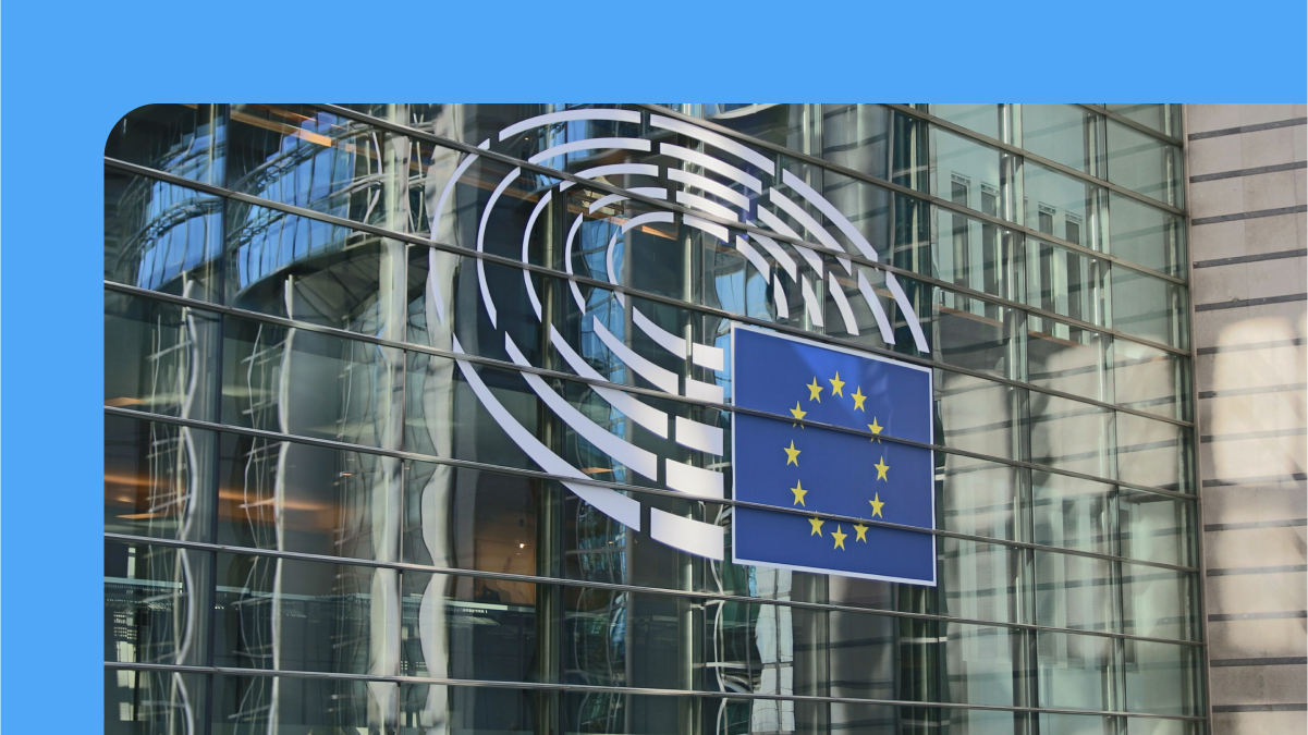 Image of a European Union flag in front of an office building